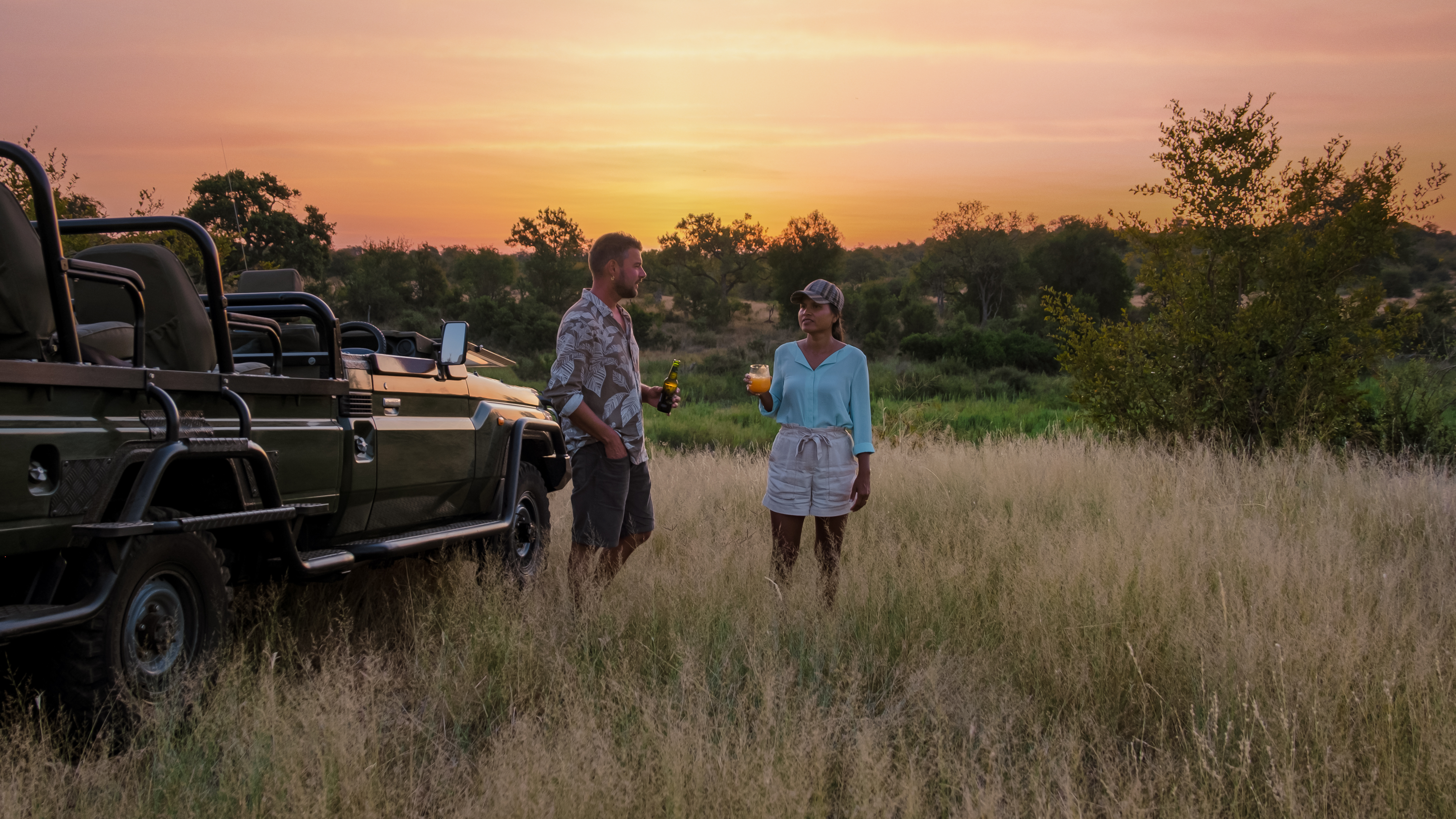 Couple reviewing Tanzania safari package options with a specialist operator, comparing itinerary structures and camp quality