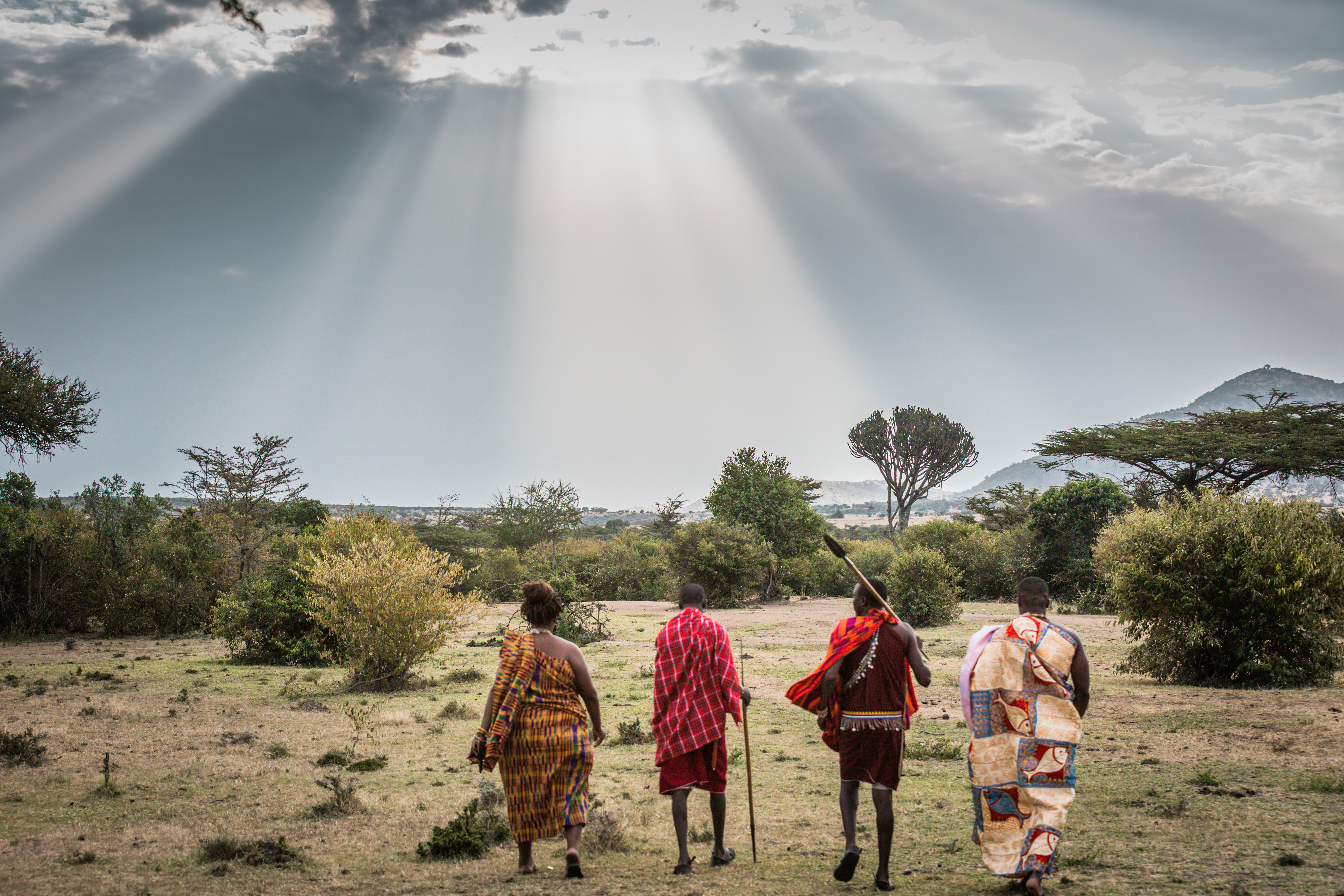 Sokwe Africa Safaris guests engaging with a Maasai community near a Tanzanian national park