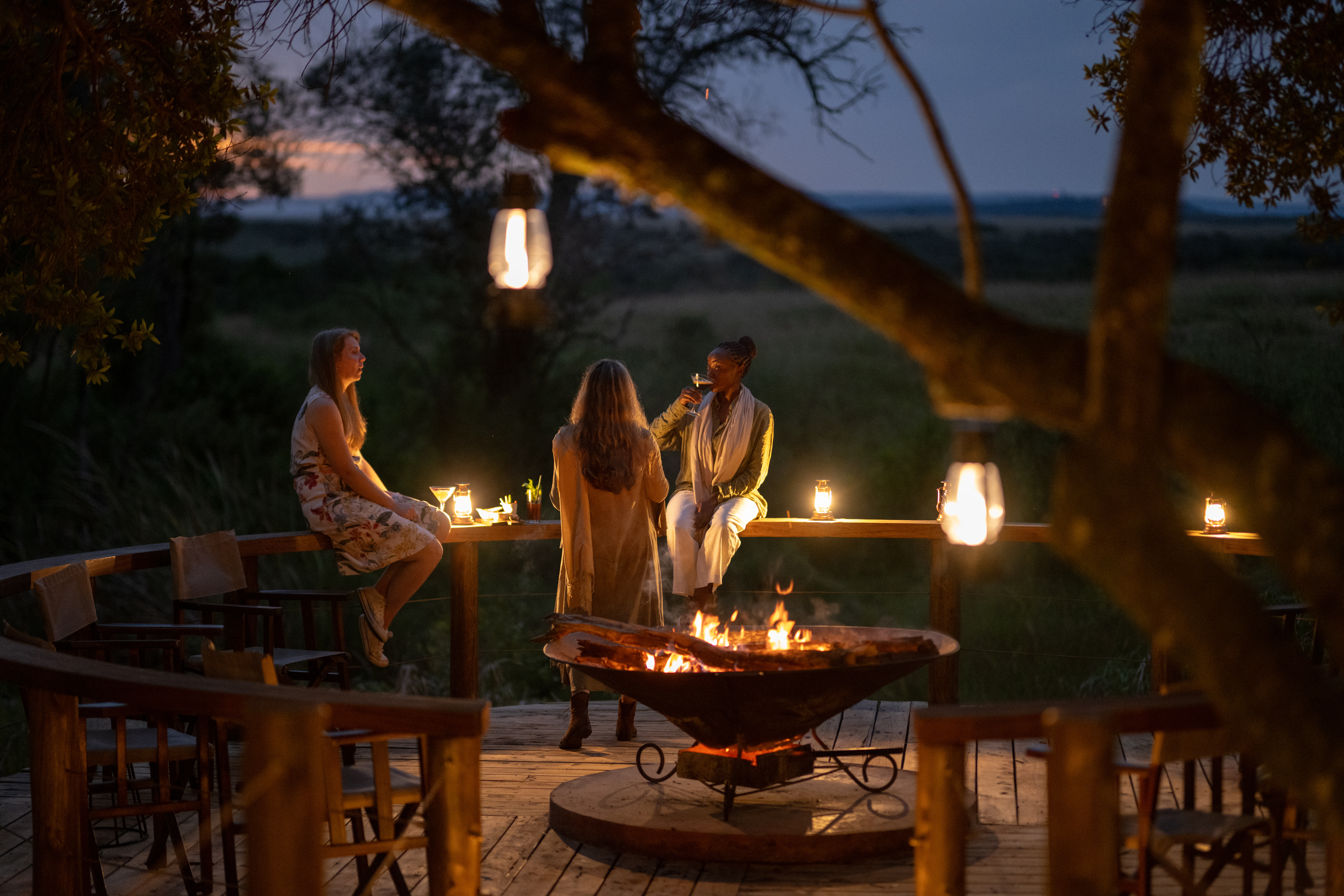 Luxury outdoor bush dinner setup at a Tanzania safari camp, a signature experience for UAE and Gulf travellers on an African safari