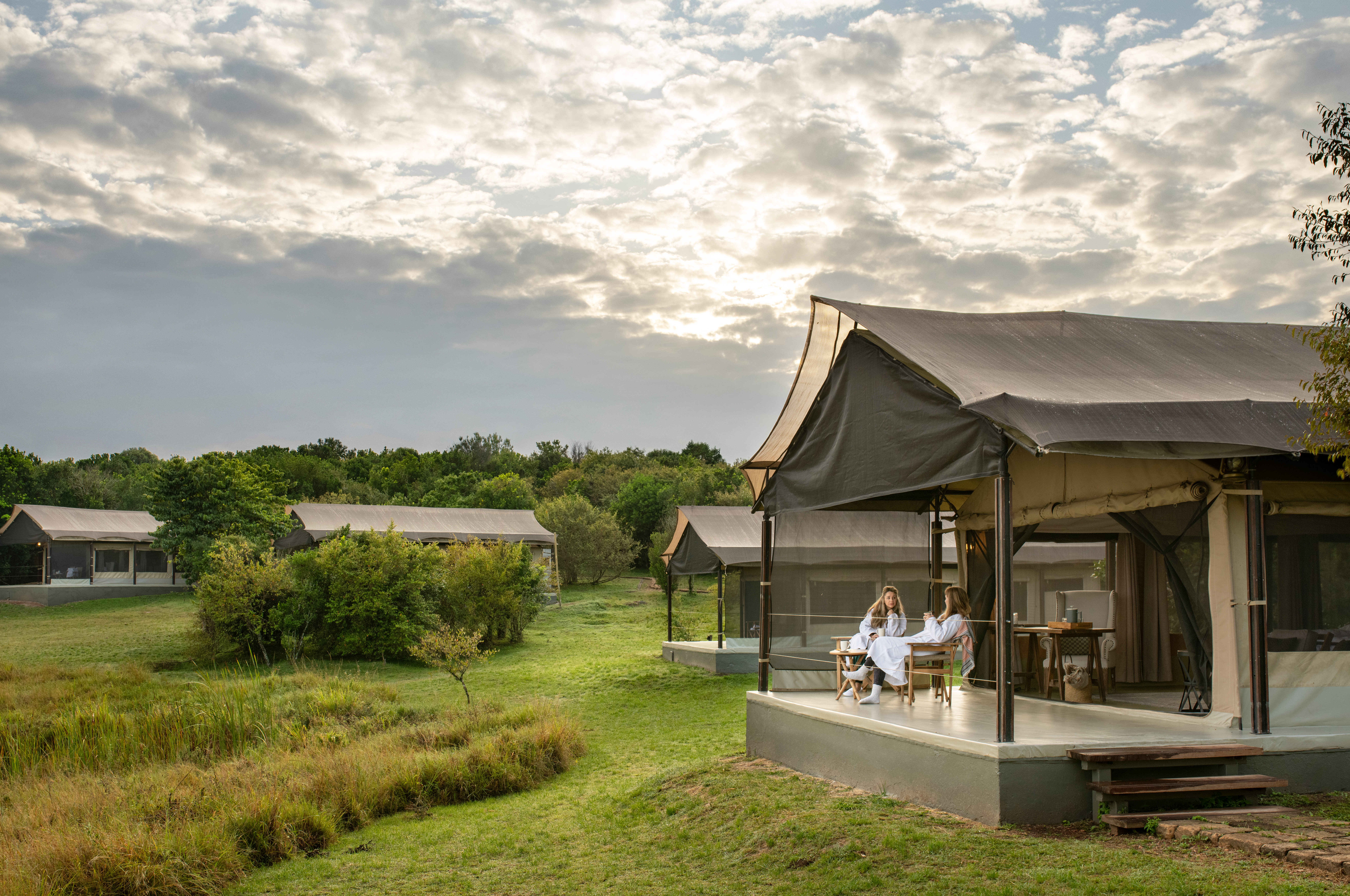 Luxury tented camp in a private Masai Mara conservancy in Kenya with open plains views and no other vehicles in sight