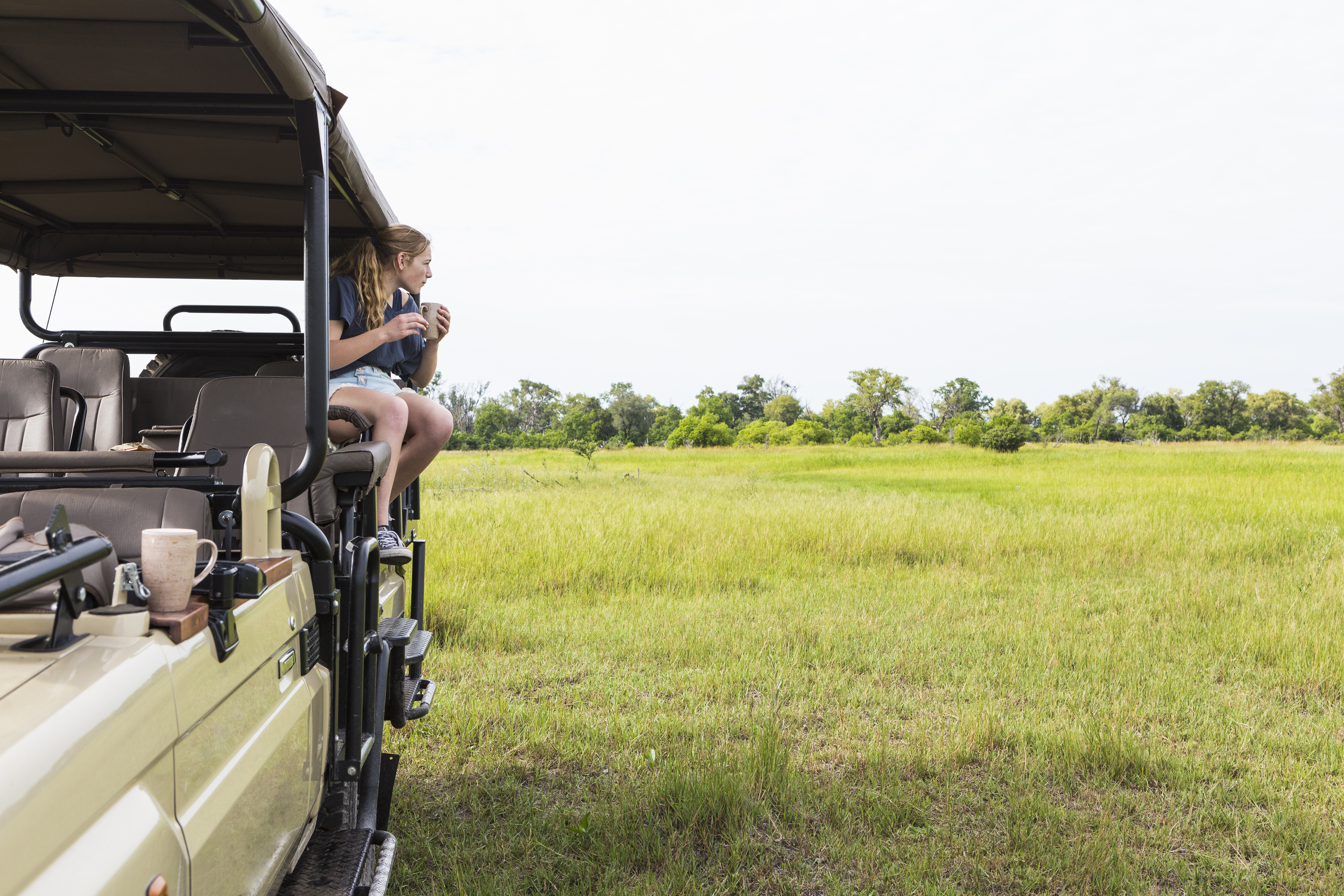 Private open-sided safari vehicle with exclusive guide in Tanzania's Serengeti — the most important element of a genuine private safari Tanzania experience