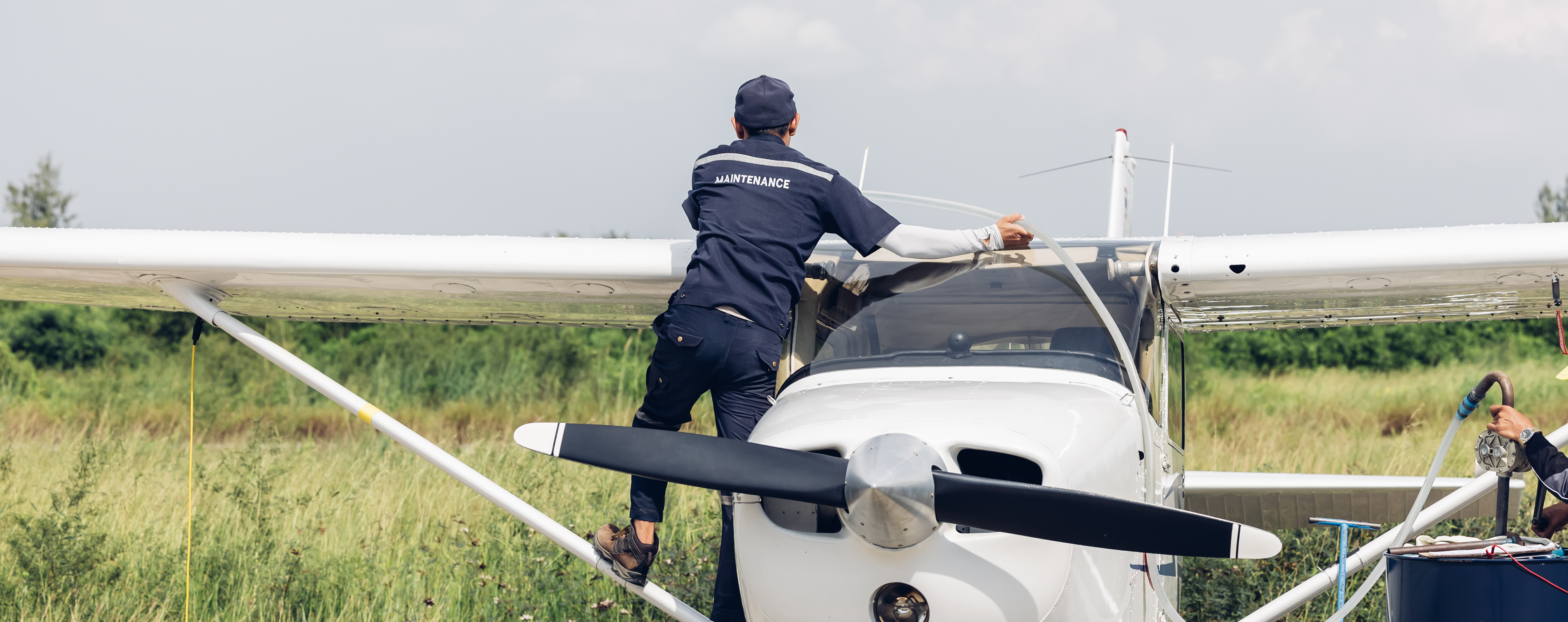 Light aircraft on a Tanzania bush airstrip preparing for the one-hour charter flight to Zanzibar — the seamless connection between safari and beach